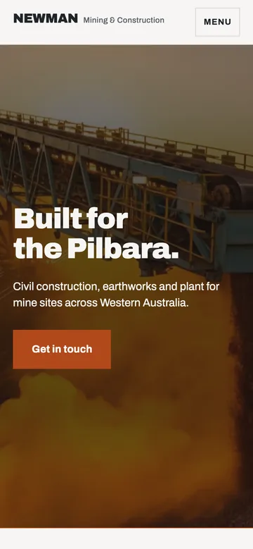 The homepage hero on a phone: the stacker and its dust plume behind the headline Built for the Pilbara